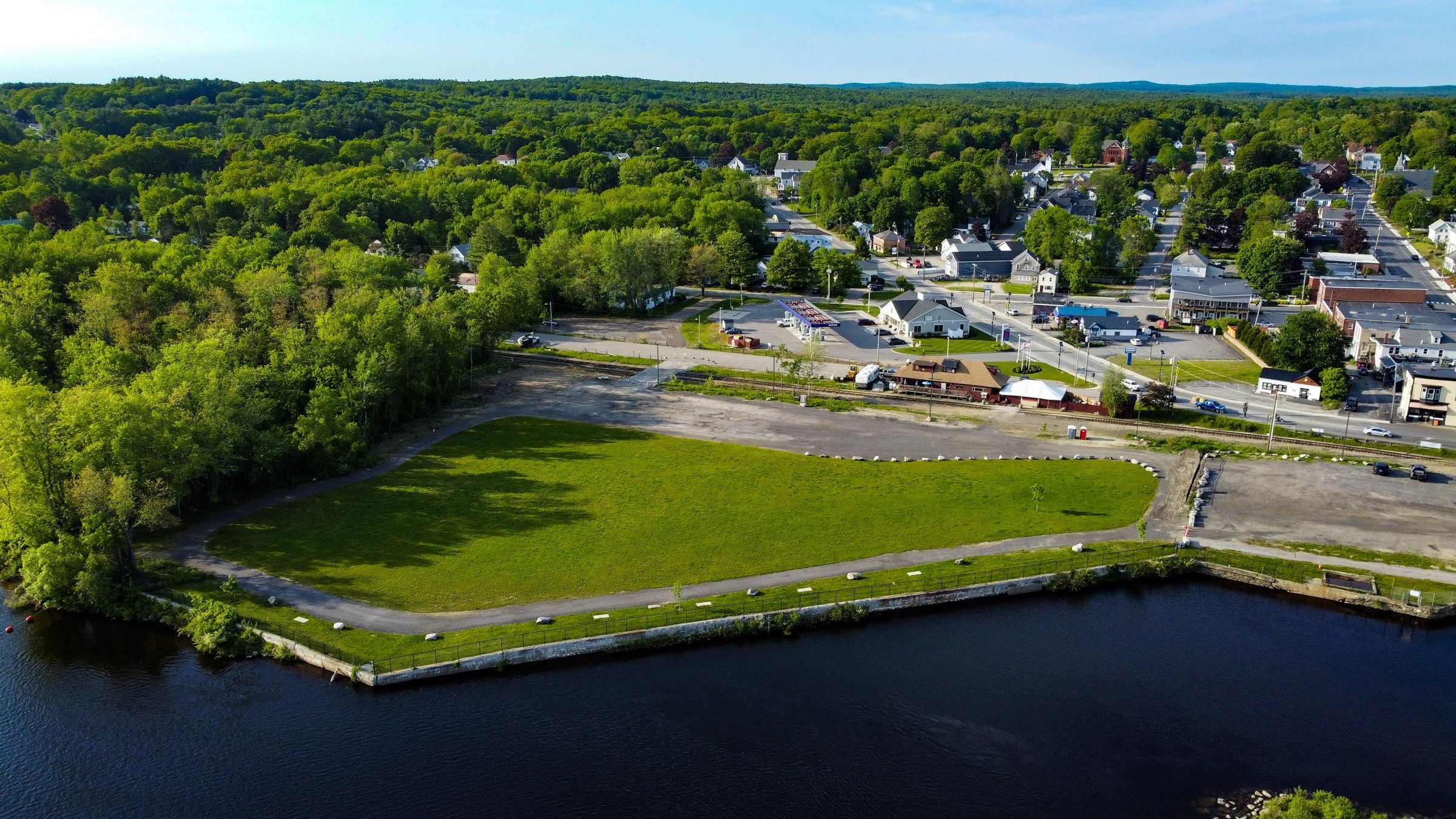 Aerial view of the Worumbo lawn on the Androscoggin River, with the village of Lisbon Falls behind it